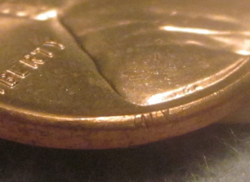 1958-Wheat-Penny-With-Part-Of-Lettering-Stamped-On-Rim/Edge?